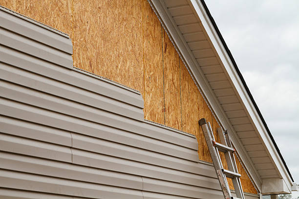 Professional Storm Damage Siding Repair technician working in Baldwin, PA